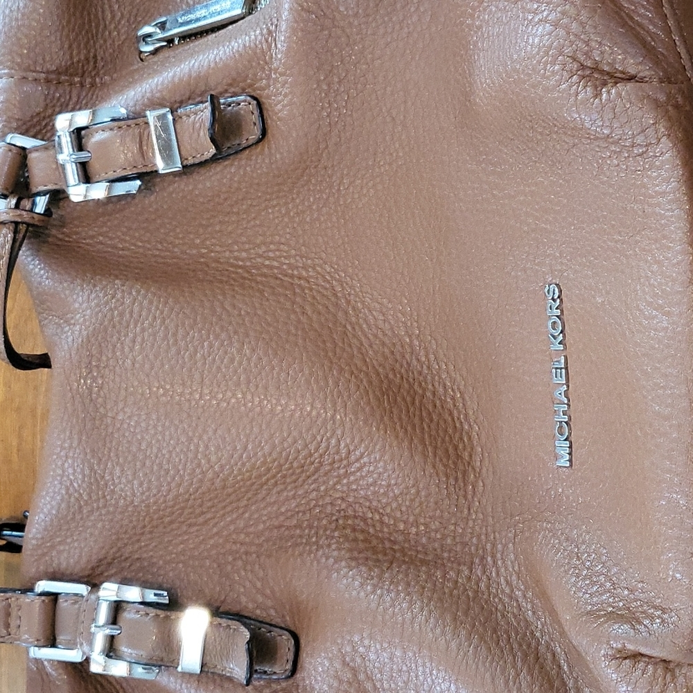 Michael Kors tan hand bag.